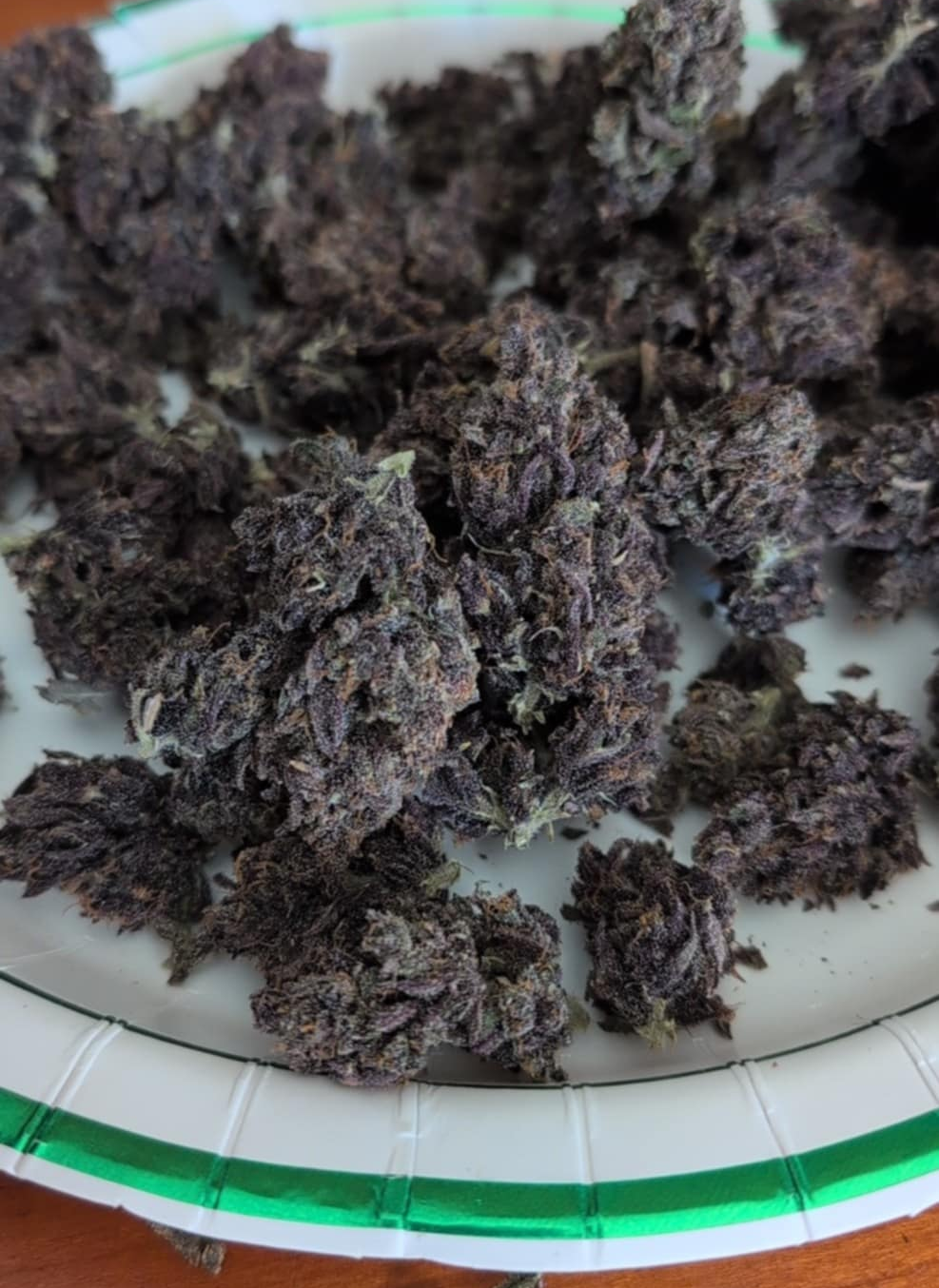 Dark purple harvested 91 Cherries flowers on a tray